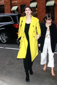 Alexandra Daddario in a Yellow Coat