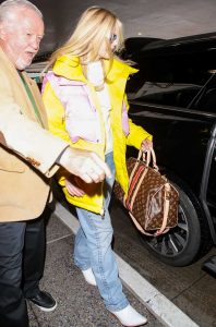 Elle Fanning in a Yellow Puffer Jacket