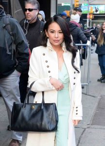 Janel Parrish in a White Trench Coat