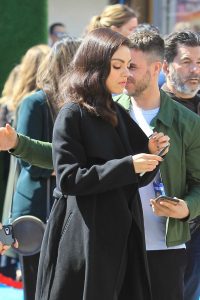 Mila Kunis in a Black Coat