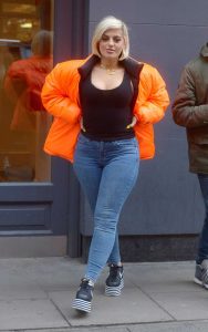 Bebe Rexha in an Orange Puffer Jacket