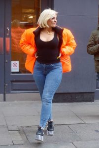 Bebe Rexha in an Orange Puffer Jacket