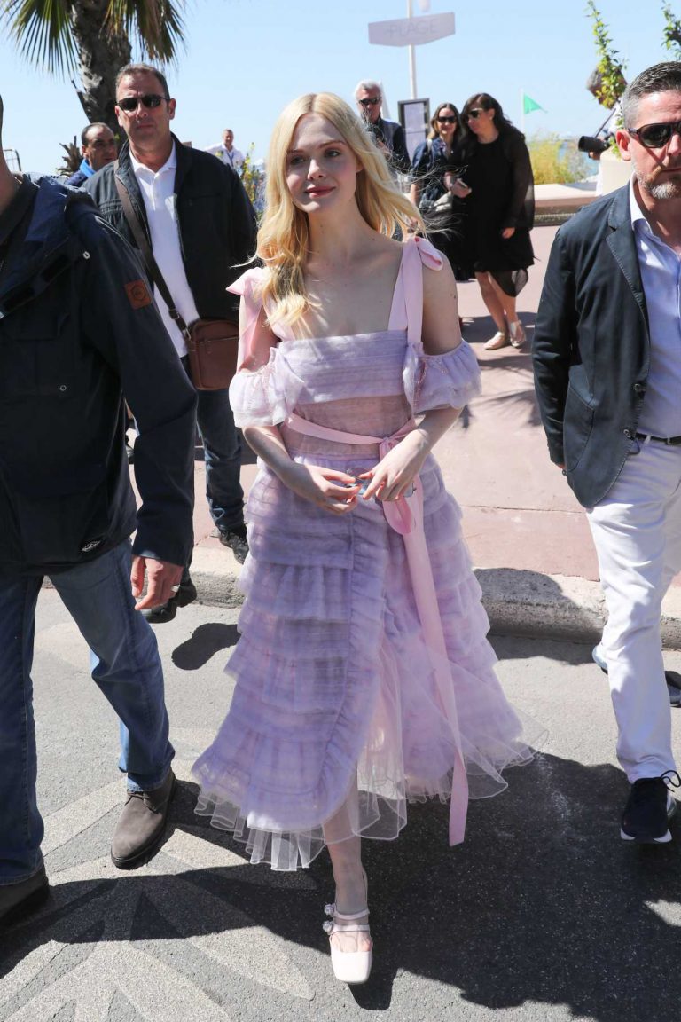 Elle Fanning in a Purple Dress Arrives at the Martinez Hotel During the