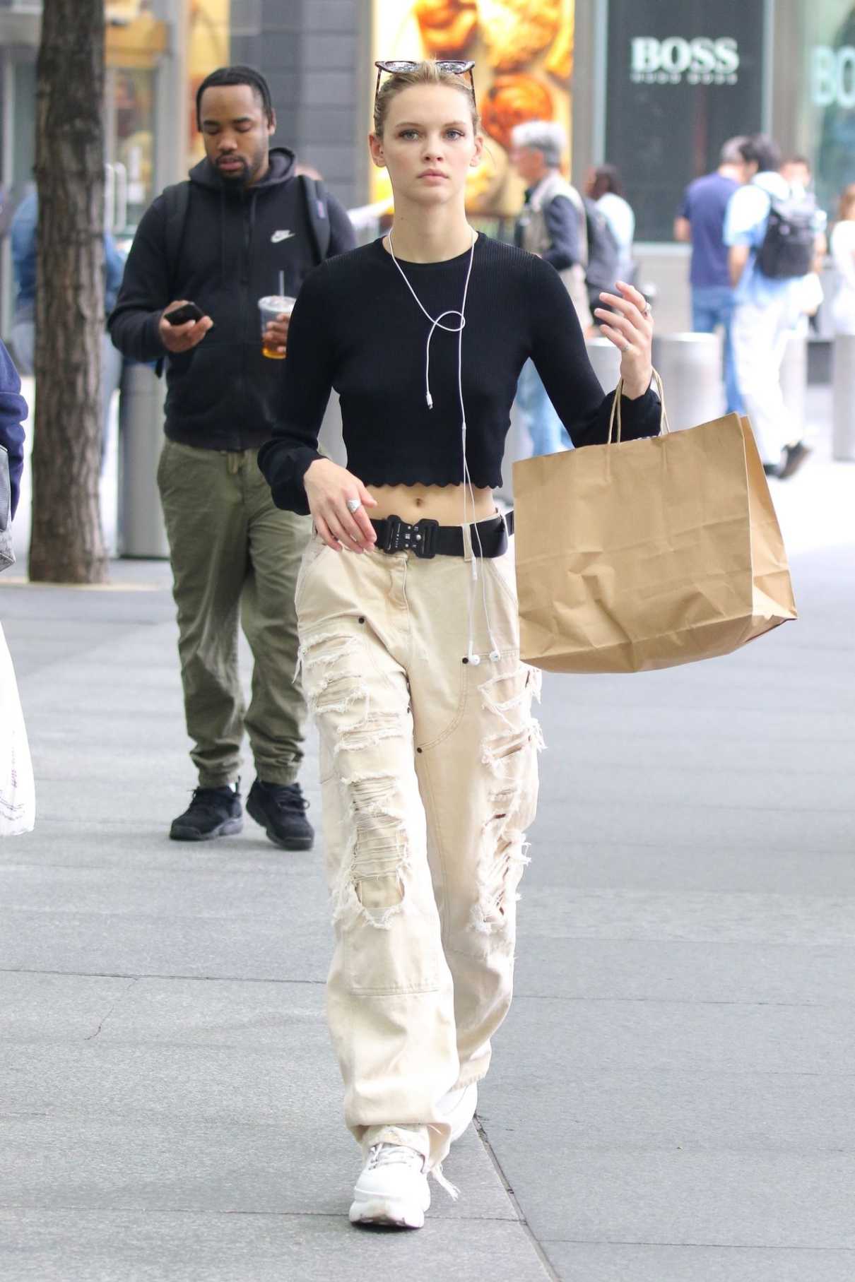 Faith Lynch in a Beige Ripped Pants