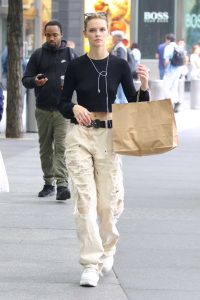 Faith Lynch in a Beige Ripped Pants