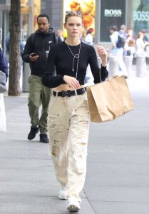 Faith Lynch in a Beige Ripped Pants