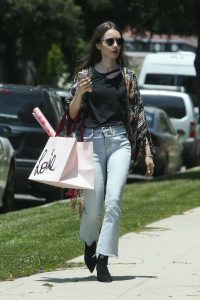 Lily Collins in a Blue Jeans