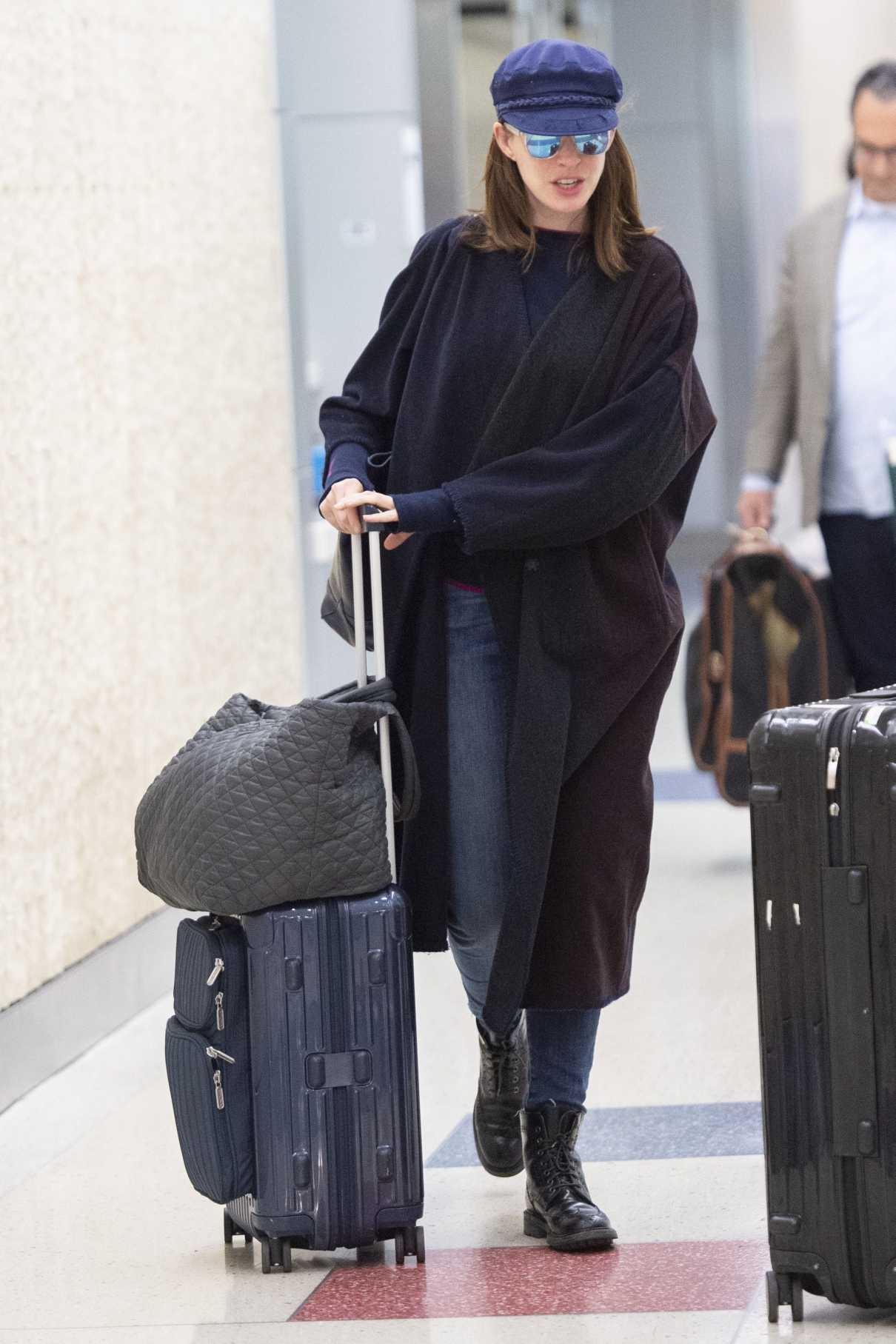 Anne Hathaway in a Black Cardigan Arrives at JFK Airport in NYC 06/12 ...