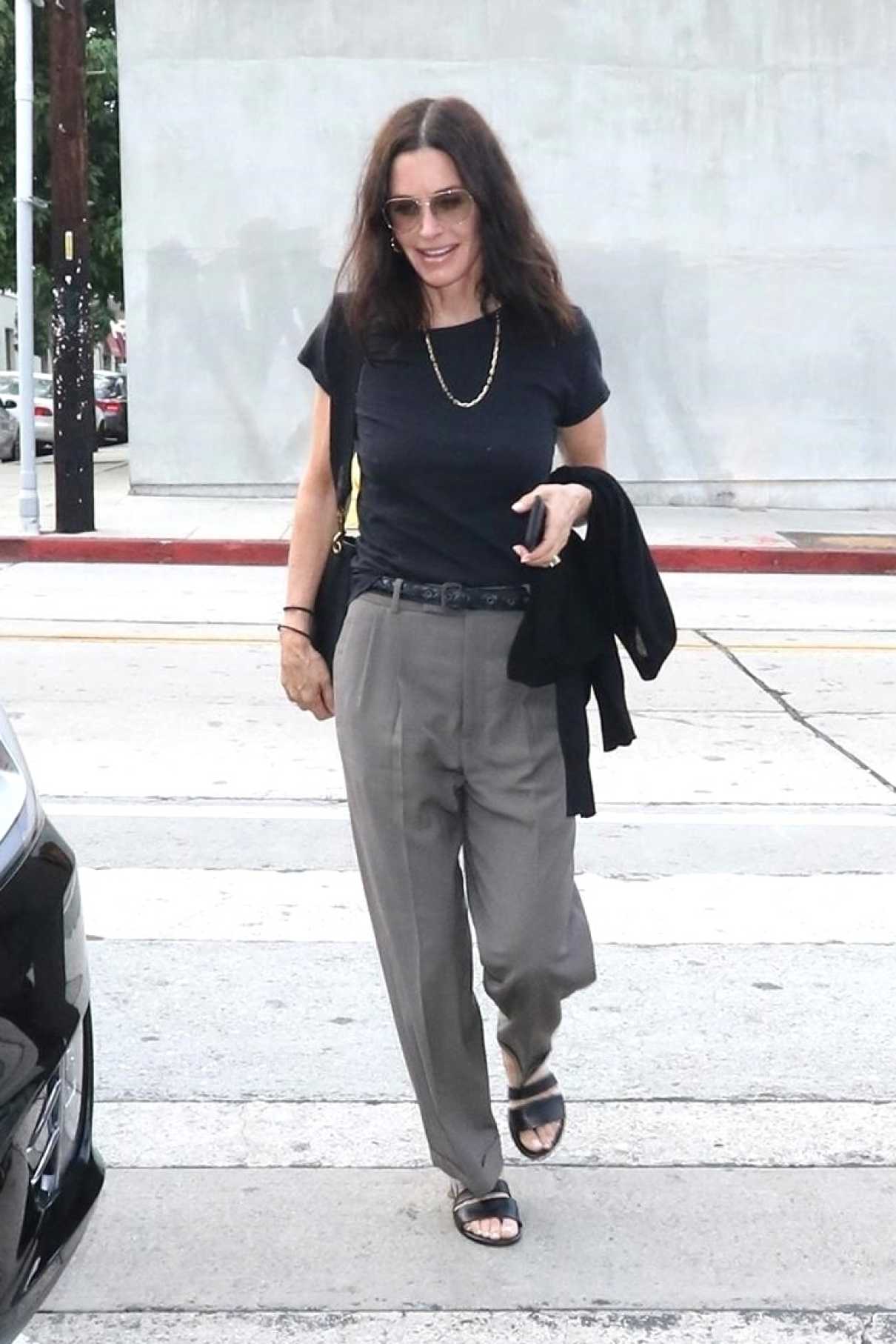 Courteney Cox in a Gray Pants