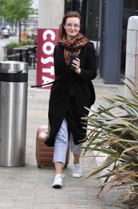 Dakota Blue Richards in a Black Coat