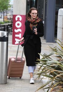 Dakota Blue Richards in a Black Coat