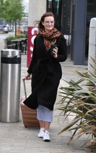 Dakota Blue Richards in a Black Coat