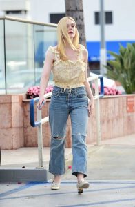 Elle Fanning in a Floral Yellow Blouse