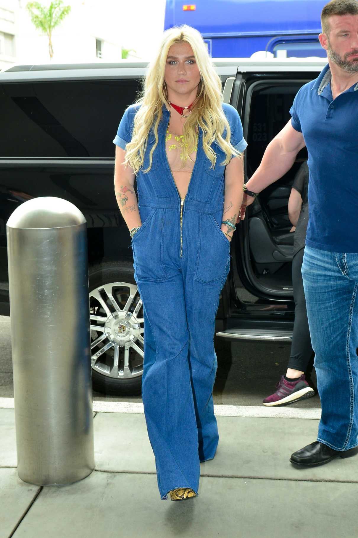 Kesha in a Blue Denim Jumpsuit