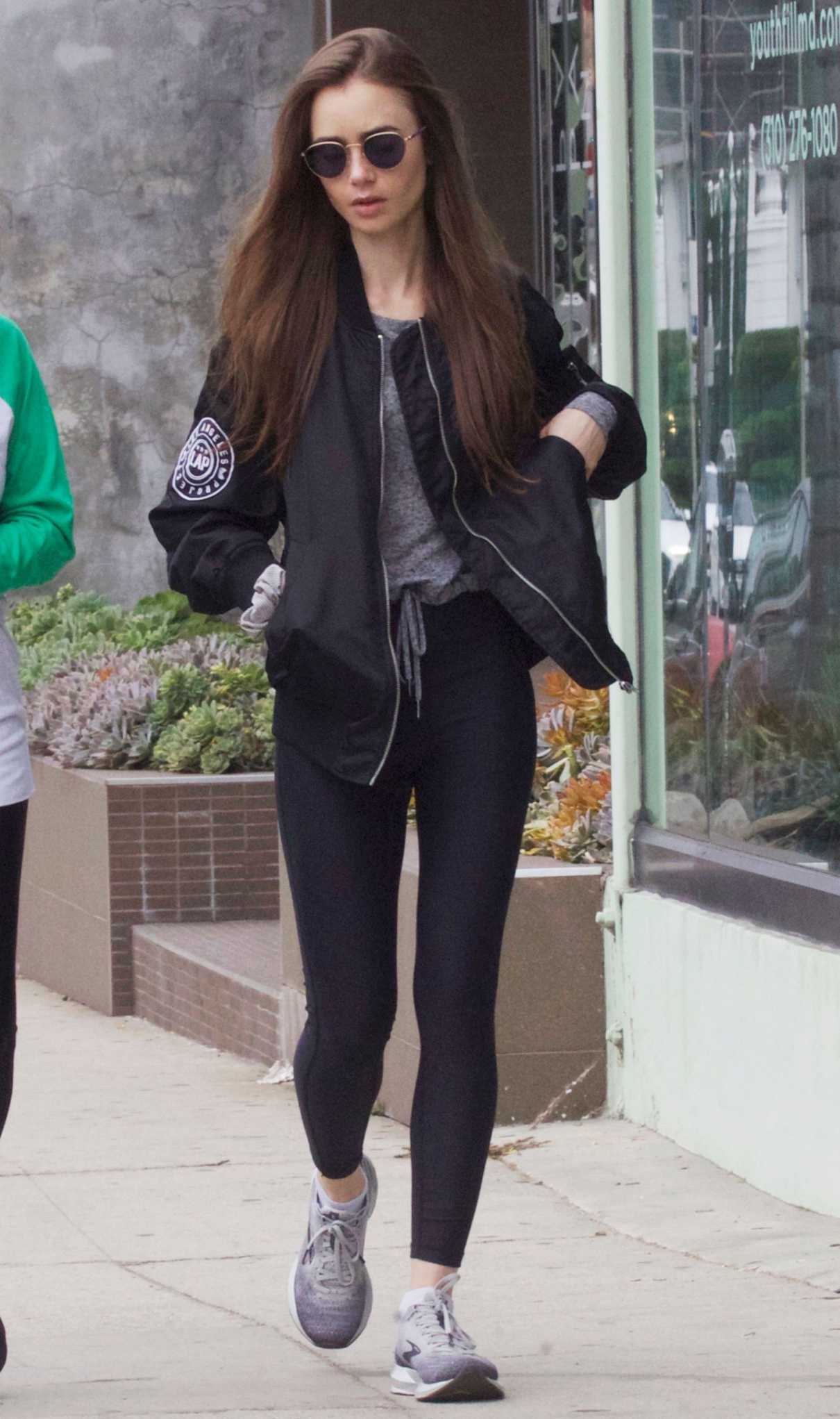 Lily Collins in a Black Bomber Jacket