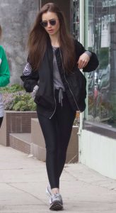 Lily Collins in a Black Bomber Jacket