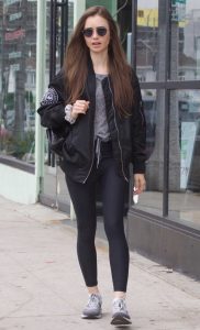 Lily Collins in a Black Bomber Jacket