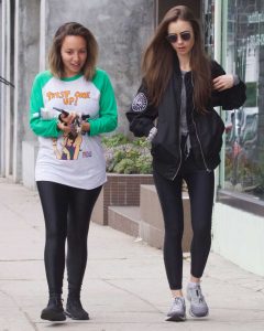 Lily Collins in a Black Bomber Jacket