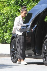 Mila Kunis in a Striped Pants