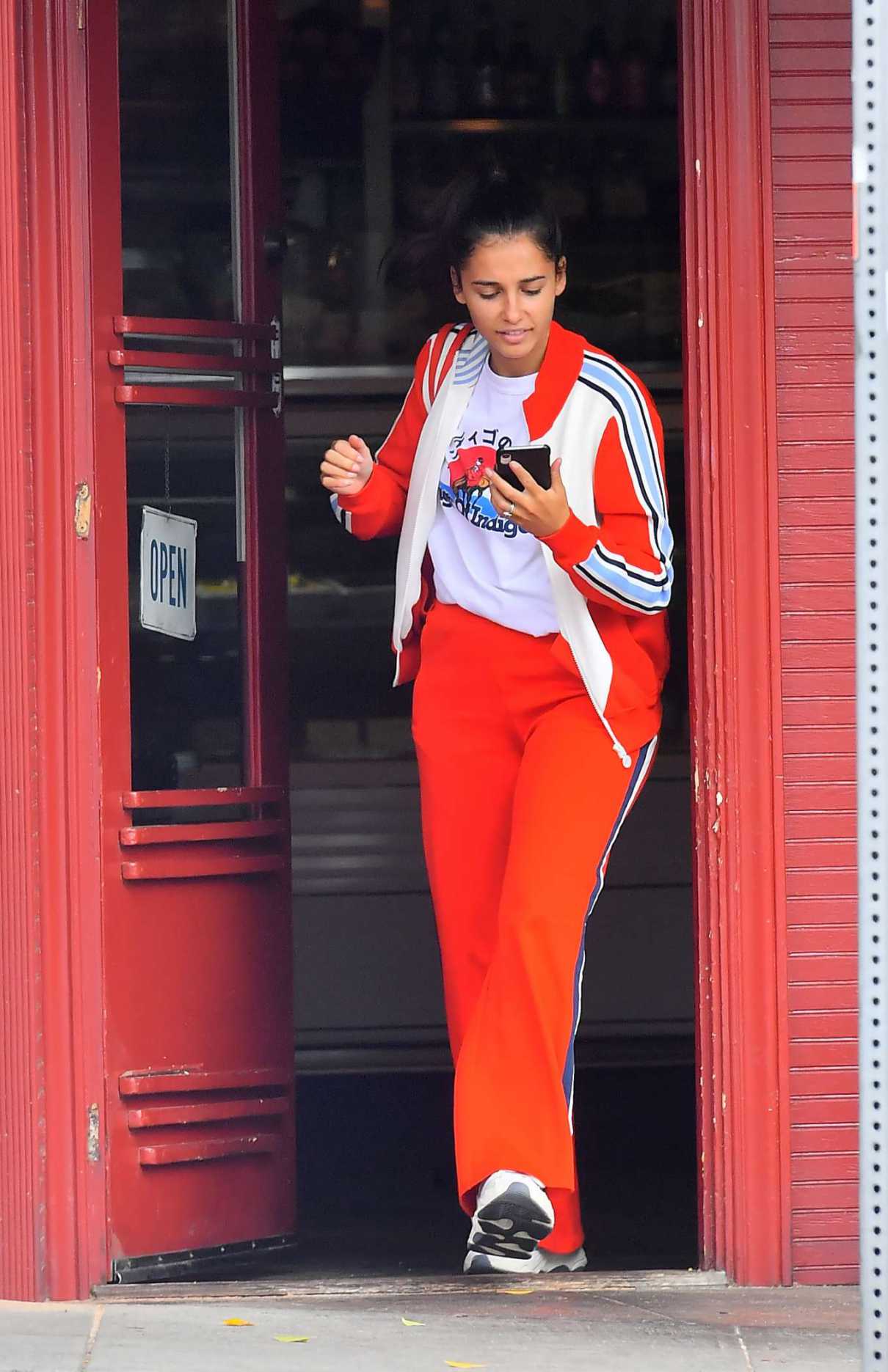 Naomi Scott in a Red Tracksuit