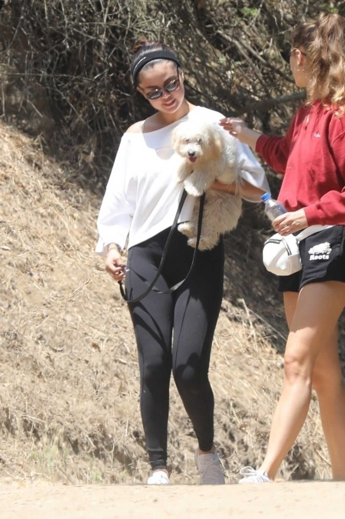 Selena Gomez in a Black Leggings Was Seen Out with Her Puppy in Los ...