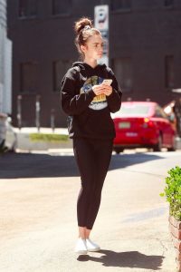 Lily Collins in a Black Hoody