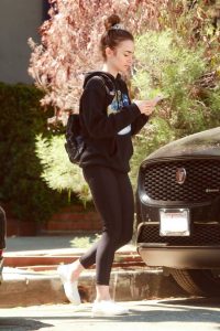 Lily Collins in a Black Hoody