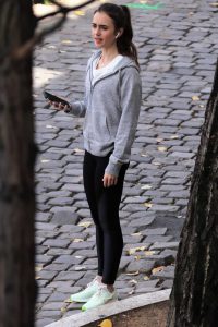 Lily Collins in a Black Leggings