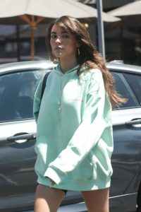 Madison Beer in a Green Hoody