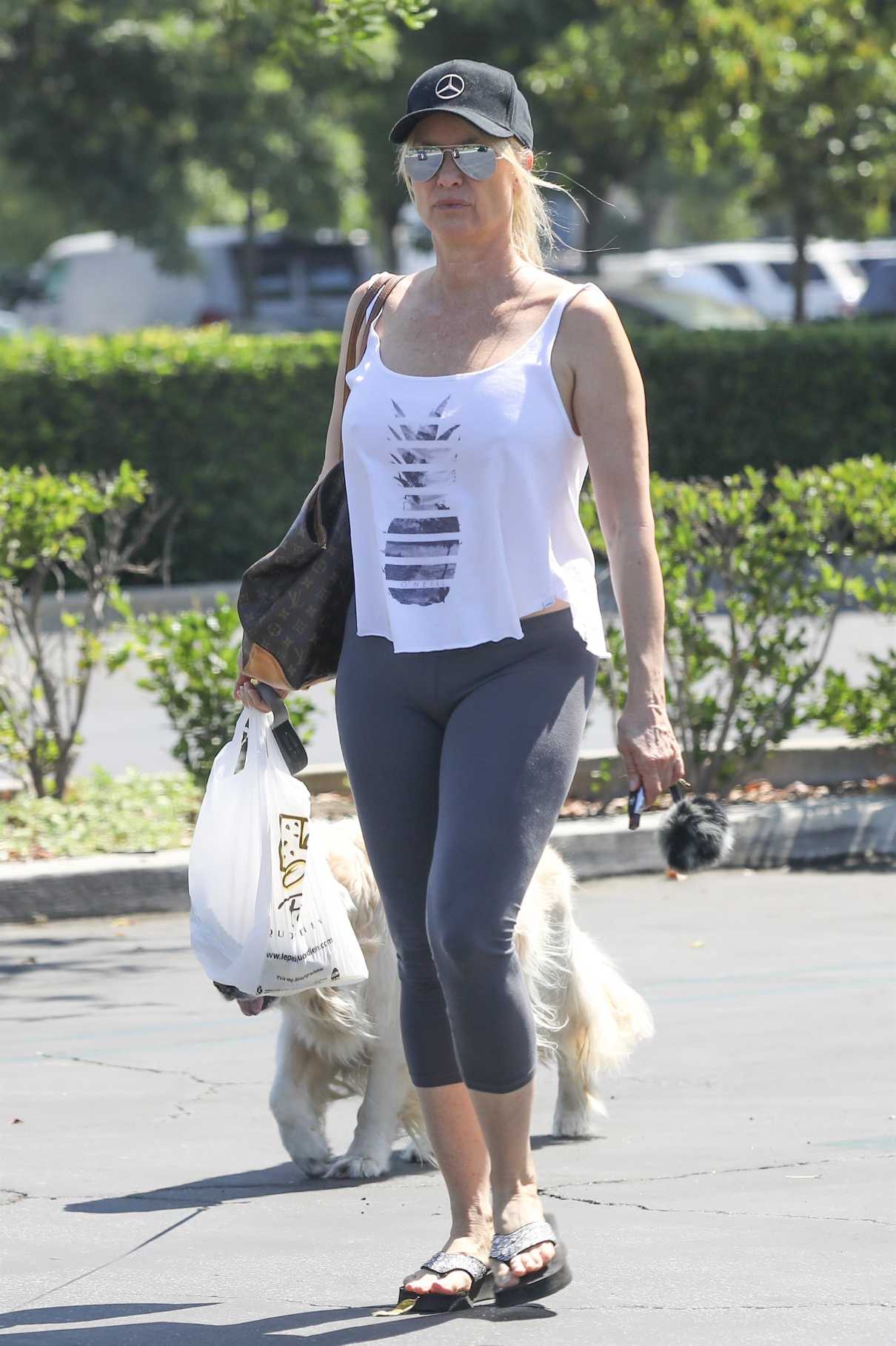 Nicollette Sheridan in a Gray Leggings