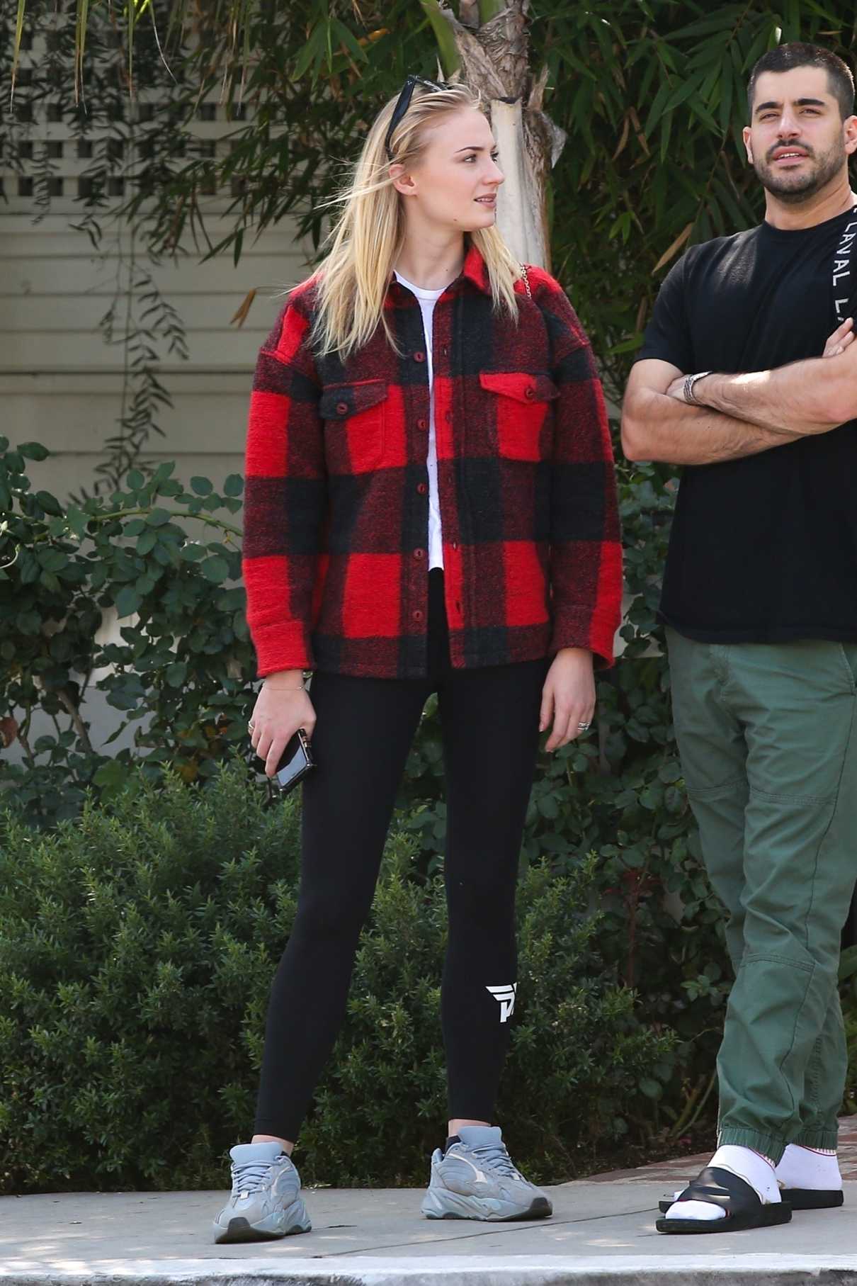 Sophie Turner in a Plaid Jacket