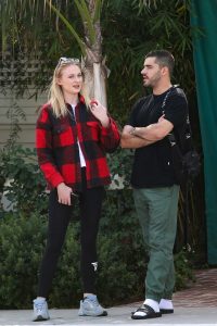 Sophie Turner in a Plaid Jacket