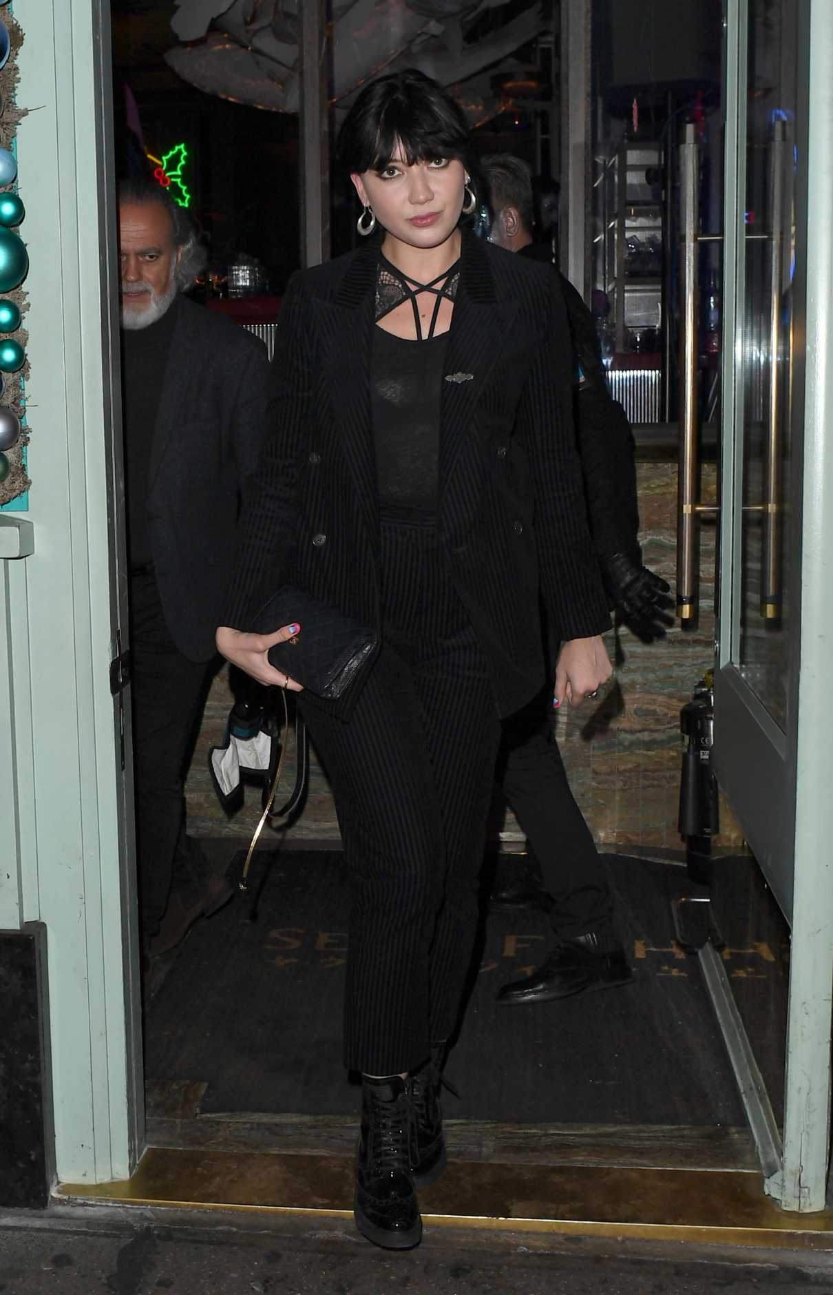 Daisy Lowe in a Black Striped Suit