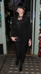 Daisy Lowe in a Black Striped Suit