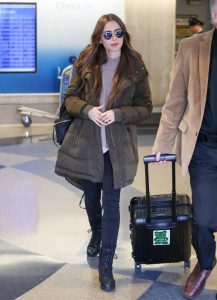 Lily Collins in a Black Boots