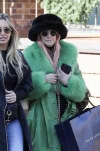 Ashlee Simpson in a Green Leather Coat