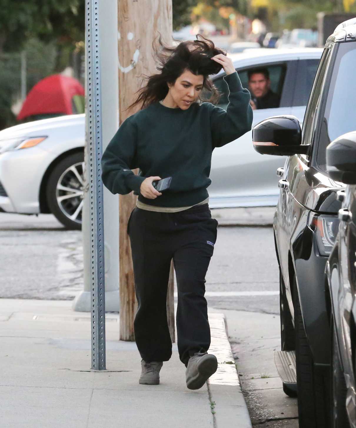 Kourtney Kardashian in a Black Sweatpants