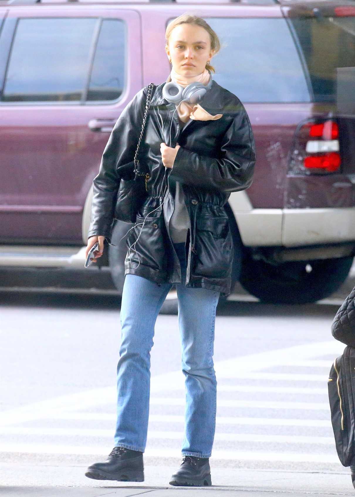 Lily-Rose Depp in a Black Leather Jacket Leaves JFK Airport in New York ...
