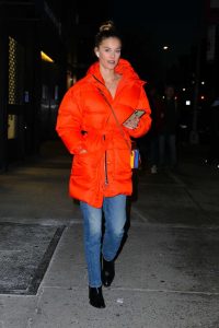 Nina Agdal in an Orange Puffer Coat