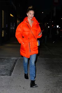 Nina Agdal in an Orange Puffer Coat