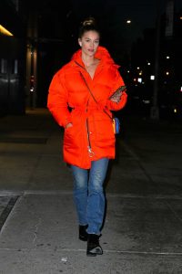 Nina Agdal in an Orange Puffer Coat