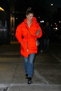 Nina Agdal in an Orange Puffer Coat