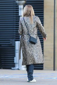 Sofia Richie in a Snakeskin Print Trench Coat