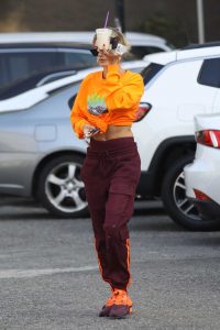 Hailey Bieber in an Orange Sweatshirt