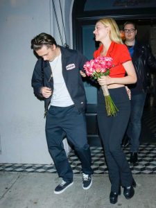 Nicola Peltz in a Red Blouse