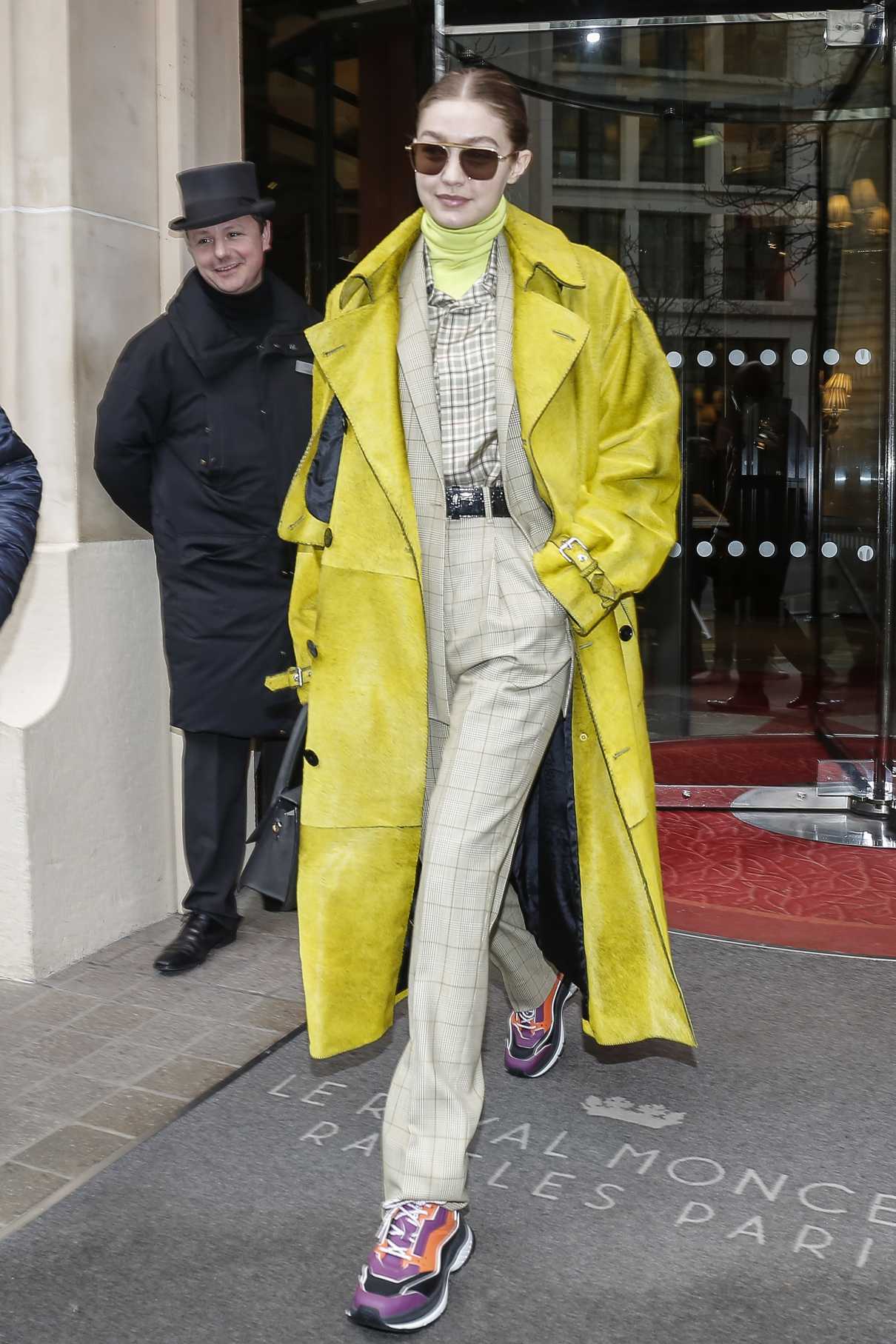 Gigi Hadid in a Yellow Trench Coat Leaves Her Hotel in Paris 02/24/2020 ...