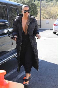 Khloe Kardashian in a Black Puffer Coat