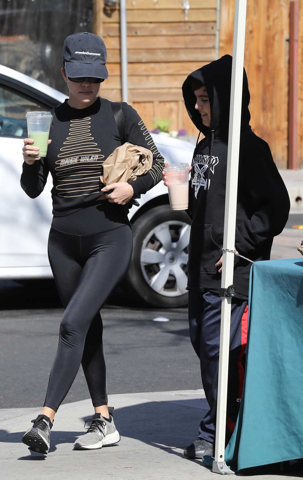 Kourtney Kardashian in a Black Cap