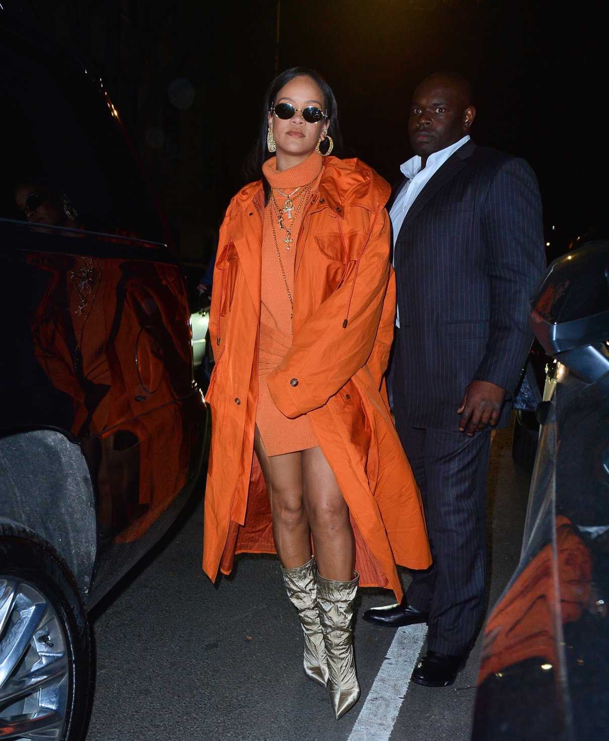 Rihanna in an Orange Trench Coat Arrives at Bergdorf Goodman for Her ...