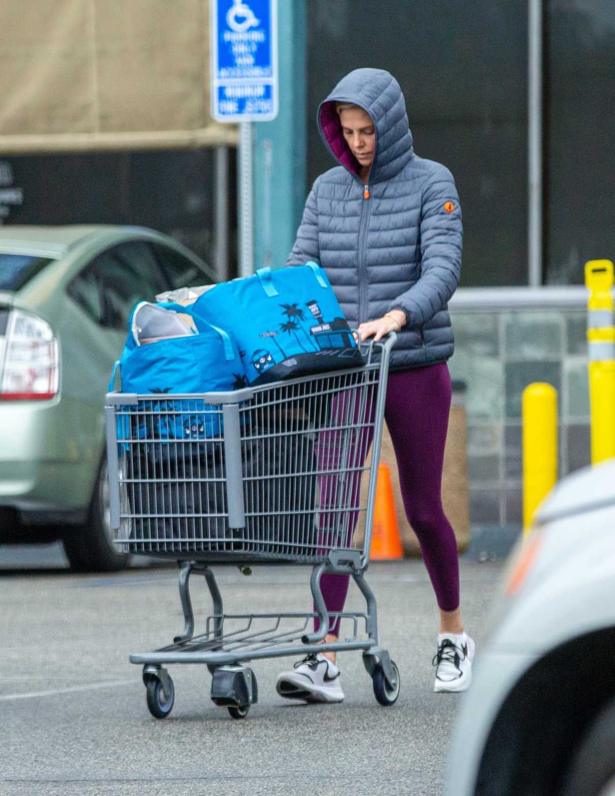 Charlize Theron in a Purple Leggings